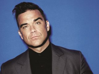 Robbie Williams espera regresar de gira este 2022